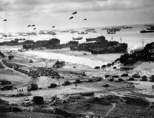 Landing ships, including Dad's, USS 533 at far right, delivering cargo to Omaha Beach, mid-June, 1944. [Wikimedia Commons]